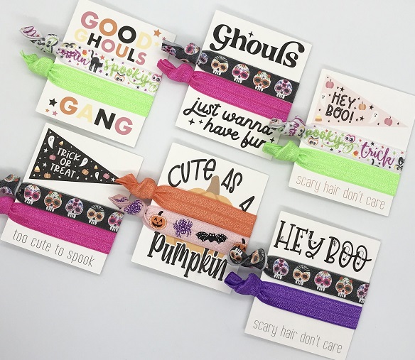 Halloween Hair Ties-with day of the dead skull design in bright colors along with solid purple tie on quality cardstock designed with Hey Boo and scary hair dont care written on it