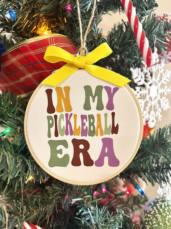 In my Pickleball Era Ornament-4 inch hoop with dtf design pressed onto durable canvas finished with yellow grosgrain ribbon